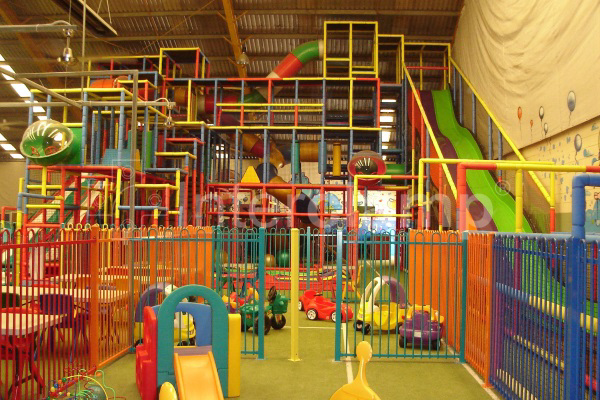 Close-up of Interclamp key clamp fittings securing the tubes of a soft play structure, demonstrating the strong and safe connections.